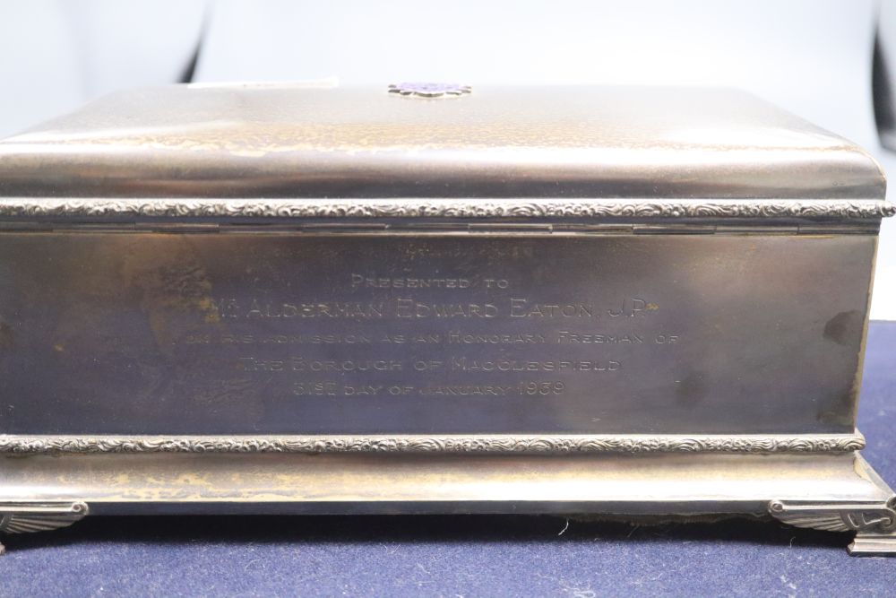 A George VI silver rectangular presentation casket, with enamelled appliques, in a blue leather box